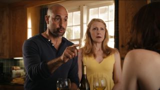 Stanley Tucci pointing and Patricia Clarkson looking confused in Easy A.