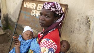 A woman holding here baby in Nigeria