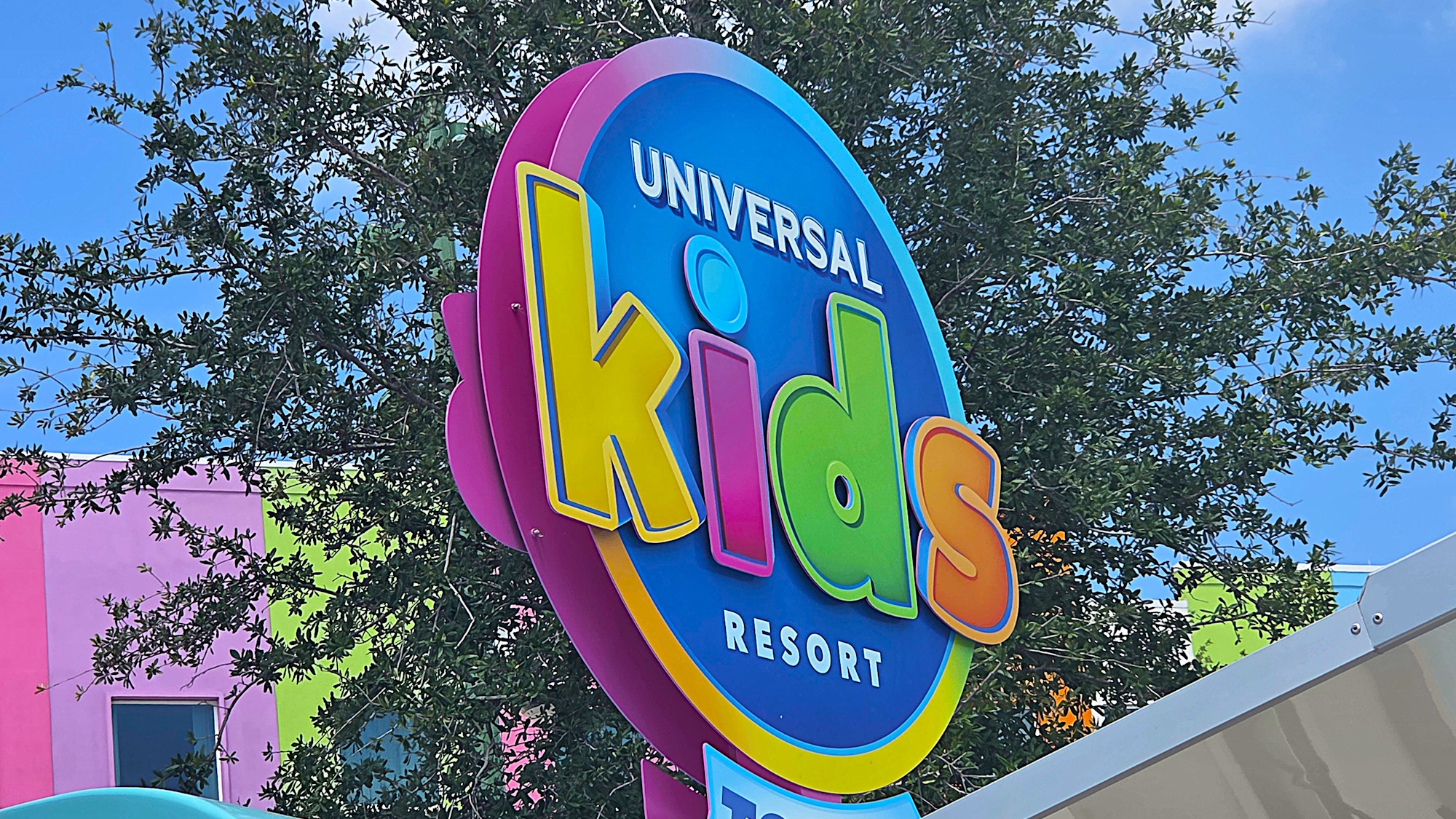 The Universal Kids Resort logo is shown on a sign in the park.