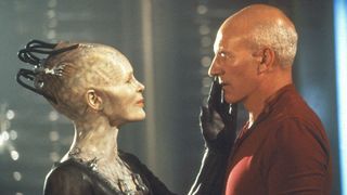 (L, R) Alice Krige as Borg Queen placing a hand on Patrick Stewart as Jean-Luc Picard's face in Star Trek: First Contact
