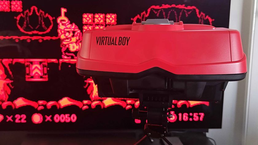 Close up of Virtual Boy headset with Wario Land gameplay in backdrop.