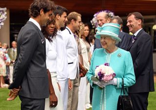 Britain's Queen Elizabeth II (Front R) meets Swiss tennis player Roger Federer, (L) Serena Williams (2nd L) of US and Novak Djokovic (3rd L) of Serbia, during a visit to the 2010 Wimbledon Lawn Tennis Championships in south-west London, on June 24, 2010