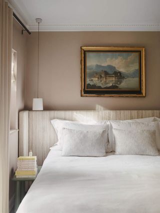 neutral toned bedroom with upholstered headboard