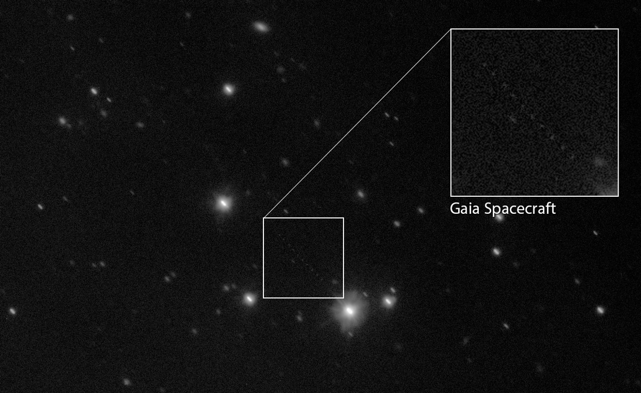 The VLT Survey Telescope in Chile caught this composite view of the Gaia space telescope streaking across the sky. The telescope's crossing appears as a faint series of dots in the lower half of the frame.