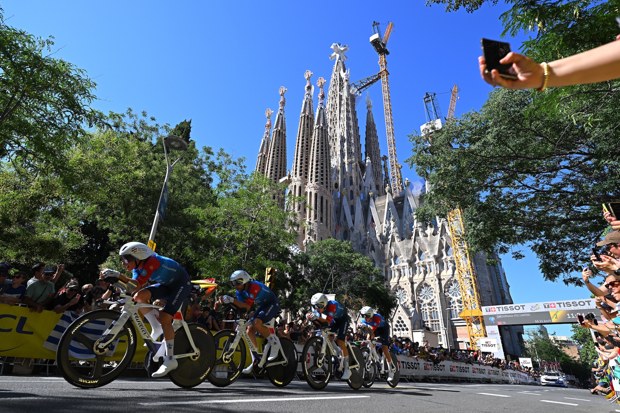 BARCELONA, SPAIN - JULY 04: Romain Gregoire of France, Clement Berthet of France, Clement Braz Afonso of France, Ewen Costiou of France, Lorenzo Germani of Italy, Guillaume Martin of France, Quentin Pacher of France, Clement Russo of France and Team Groupama - FDJ United compete with a view of the La Sagrada Familia in the background during the 113th Tour de France 2026, Stage 1 a 19.6km team time trial stage from Barcelona to Barcelona / #UCIWT / on July 04, 2026 in Barcelona, Spain. (Photo by Tim de Waele/Getty Images)