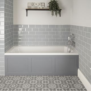 built in bath with grey metro tiles