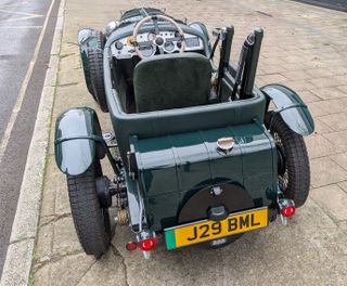 The original's rear-mounted fuel tank is now a luggage trunk