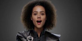 Missandei in a warm black dress and cloak