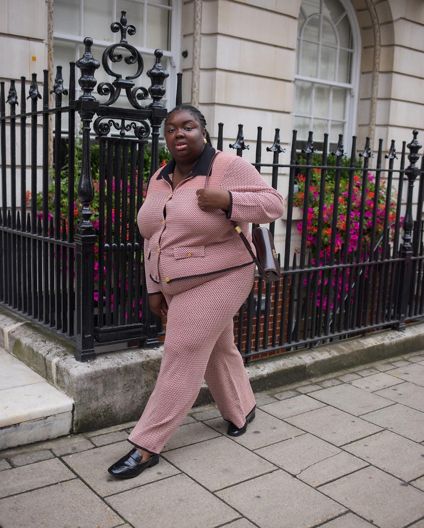 Fashion person Abi Marvel wears London winter shoe trends 2025. She wears mock croc loafers.