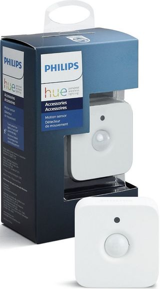 Philips Hue motion sensor in front of the product's packaging