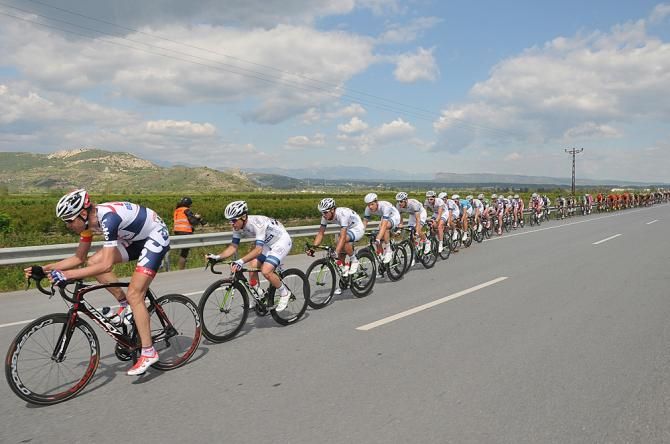 The peloton headed toward the finish flat out, single file
