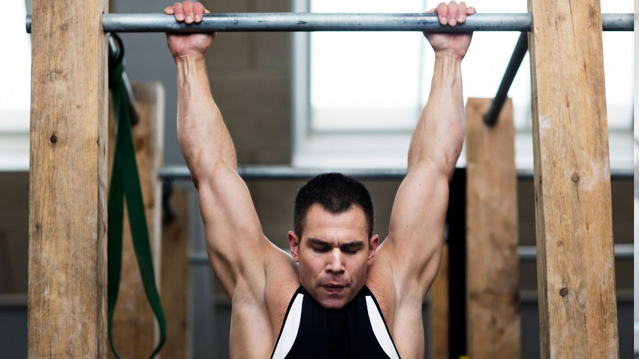 A man performing pull up