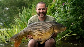 Joe Savage shows off his winning catch.