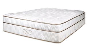 The Saatva Classic mattress shown at an angle so you can see the quilted top and durable base