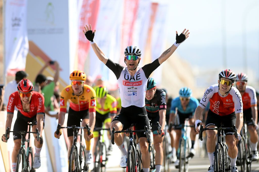 YITTI HILLS OMAN FEBRUARY 14 Diego Ulissi of Italy and UAE Team Emirates celebrates at finish line as race winner ahead of Axel Zingle of France and Team Cofidisduring the 12th Tour of Oman 2023 Stage 4 a 2049km stage from Izki to Yitti Hills 147m TourofOman on February 14 2023 in Yitti Hills Oman Photo by Alex BroadwayGetty Images