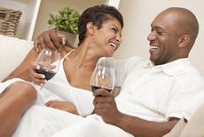 Happy couple drinking wine.