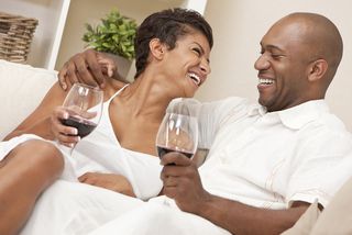 Happy couple drinking wine.