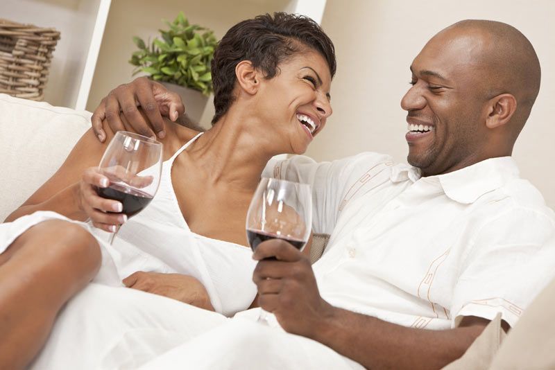 Happy couple drinking wine.