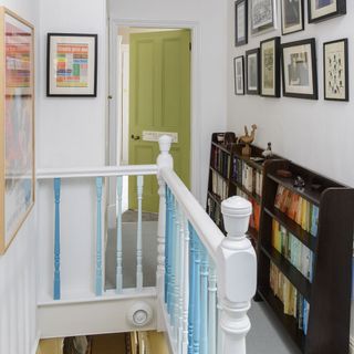 passage area with book shelves and white walls