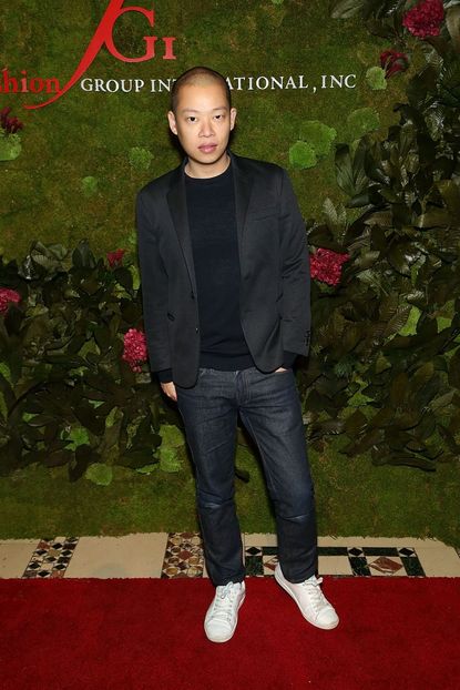 Jason Wu in front of some greenery