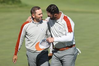 Sergio Garcia and Jon Rahm chat during the Ryder Cup