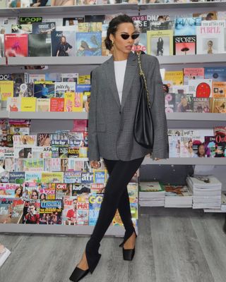 Rochelle Humes styles black leggings with black mules.