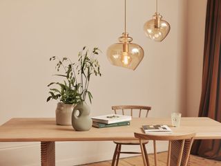 Salted caramel ceiling pendant over dining table