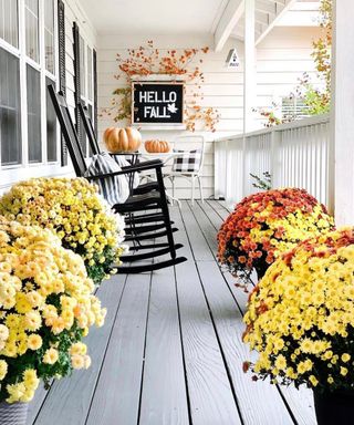 front porch with hello fall wall decor - @homehydrangea