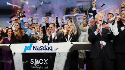 SpaceX staff celebrate public listing