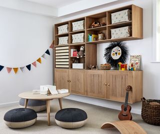 playroom with wall mounted storage and low stools and table