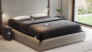 Black Eight Sleep Pod 5 Ultra smart sleep system on bed in bedroom with big window looking out to greenery