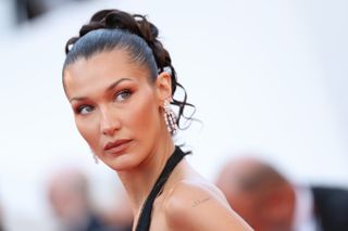 Bella Hadid attends the "L'Amour Ouf" (Beating Hearts) Red Carpet at the 77th annual Cannes Film Festival at Palais des Festivals on May 23, 2024 in Cannes, France.