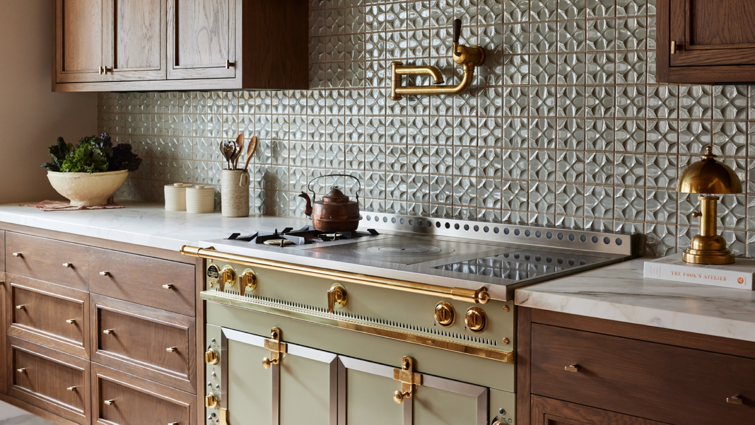 dark wood kitchen with green aga oven and range hood by Kristen Pena