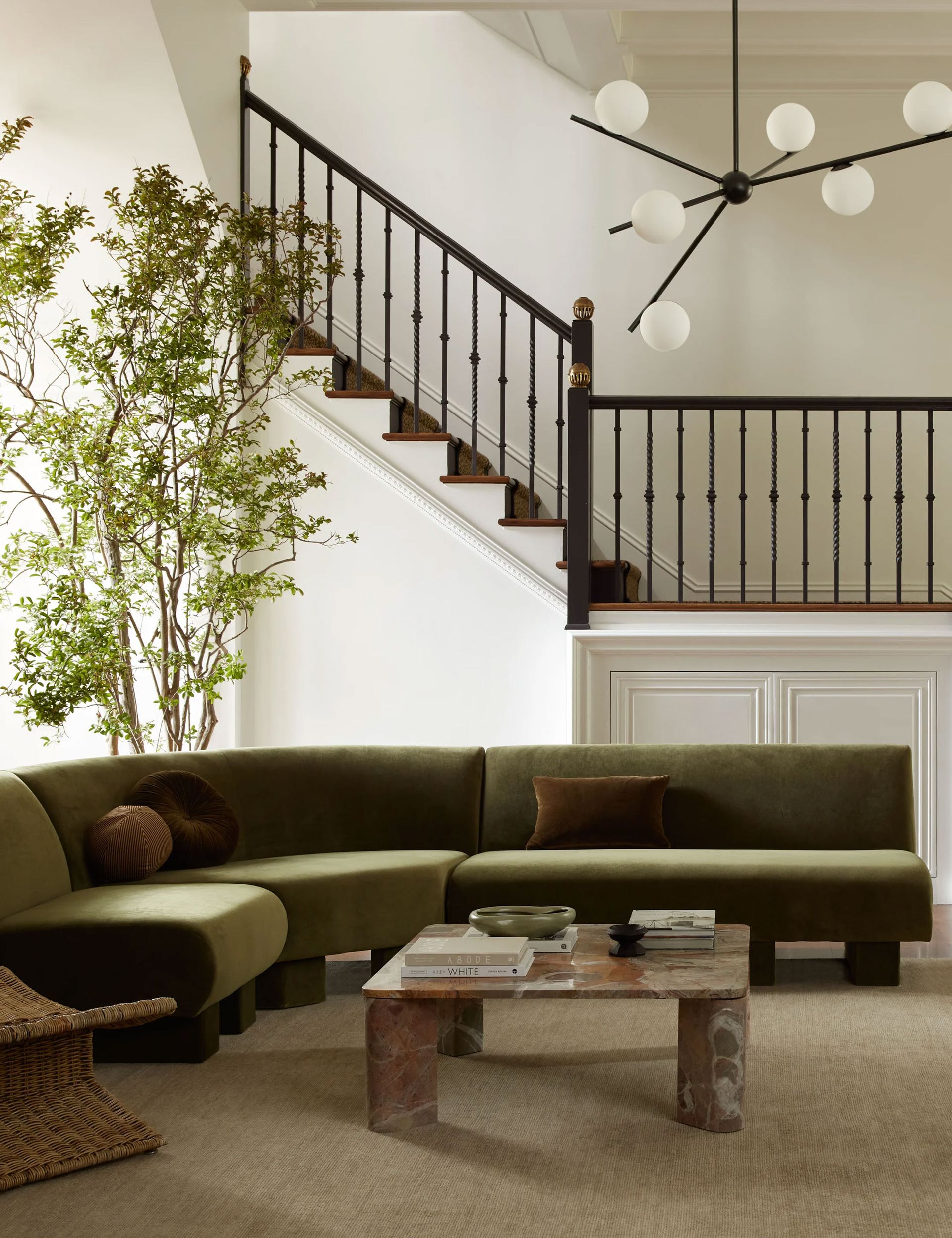 Lulu and Georgia living rom with green sofa, marble coffee table