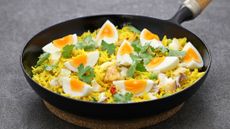 Kedgeree dish with eggs and fish served in a pan