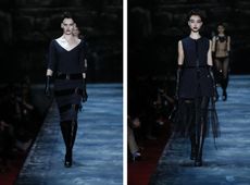 2 Models on runway wearing black skirt and dress, black knee high boots and elbow length gloves