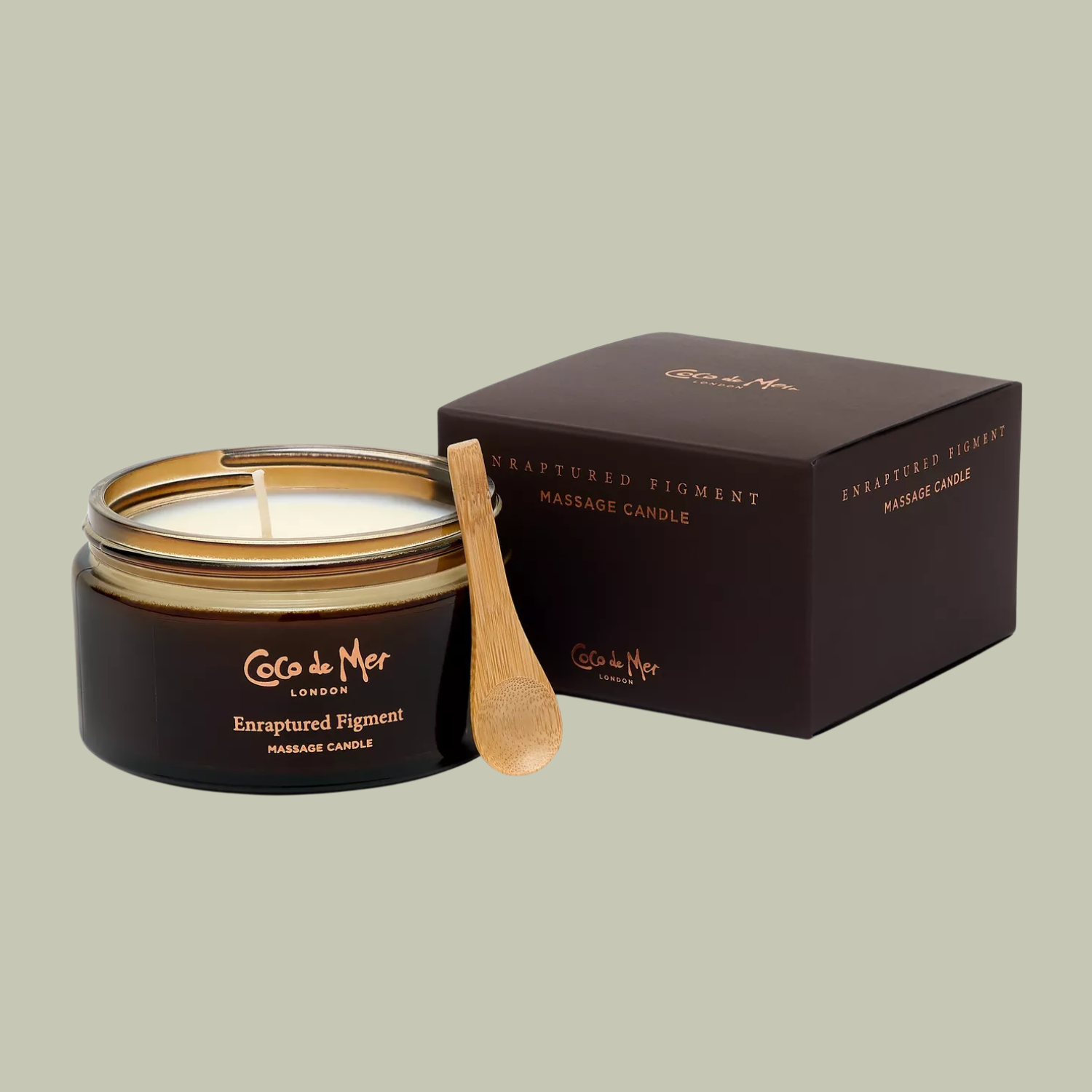 A brown massage candle with a wood spoon