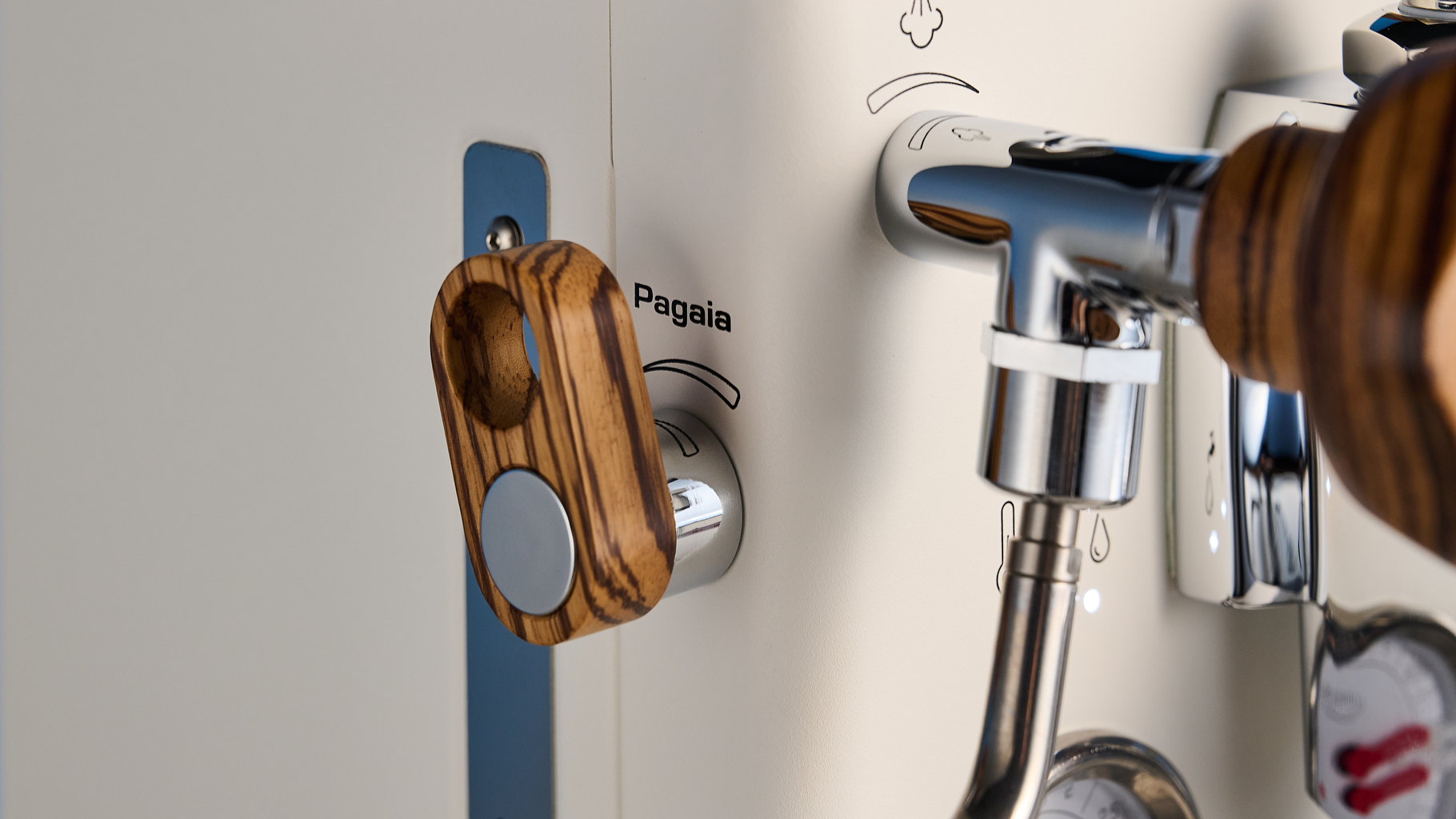 the lelit mara x3 in white and walnut photographed against a blue tom's guide background