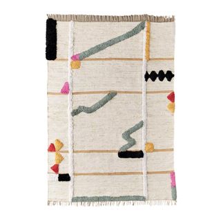 cream rug with abstract colorful patterns
