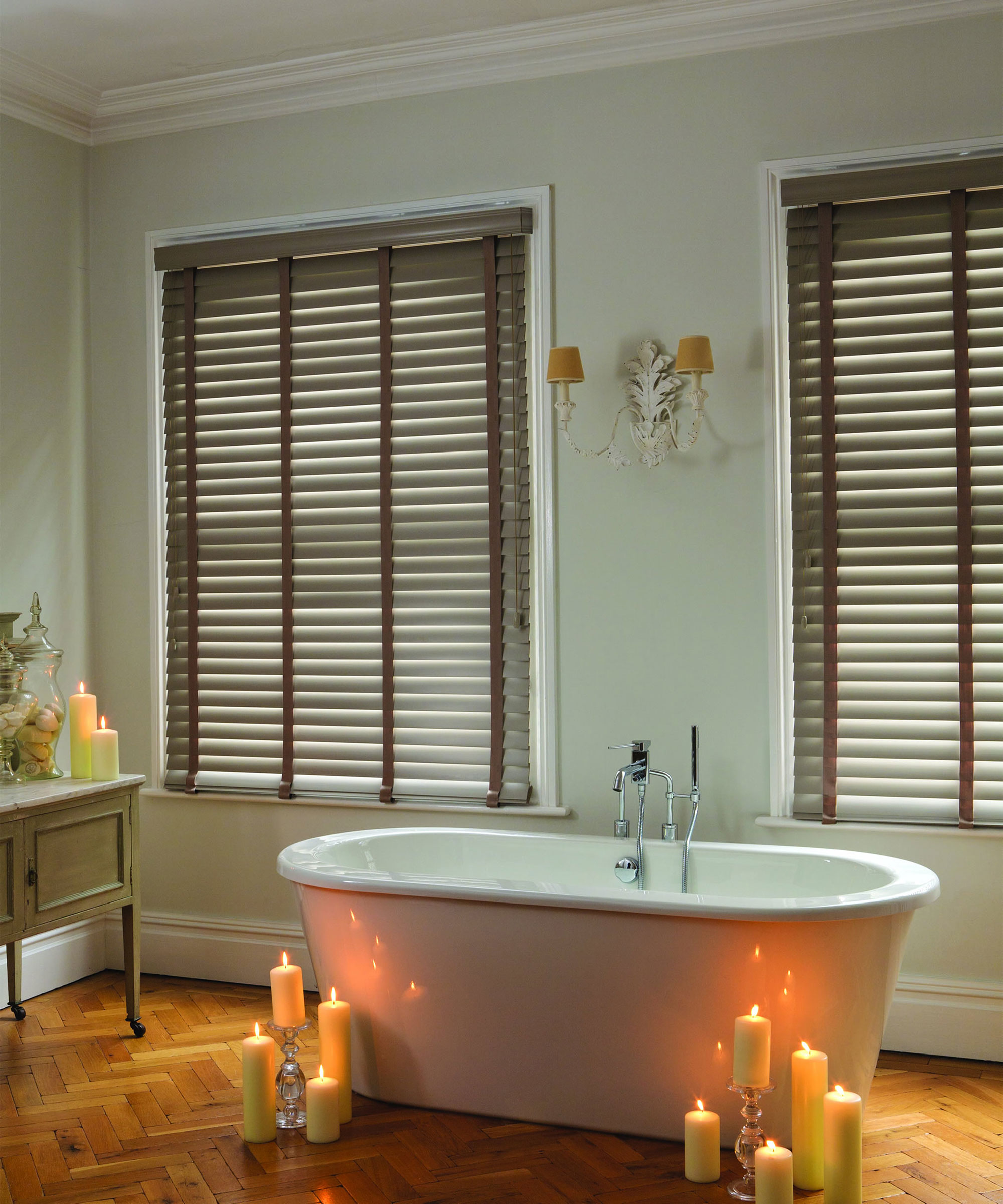rolltop bath in bathroom with wooden Venetian blinds