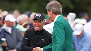 Gary Player shakes hands with Fred Ridley at The Masters