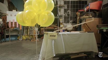 The Fed's interest rate decisions, explained through a Rube Goldberg machine