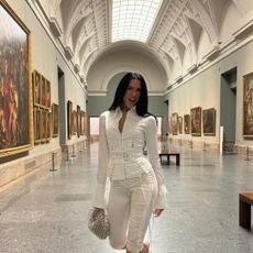 Dua Lipa at Madrid's Prado museum, posing in a Dilara outfit