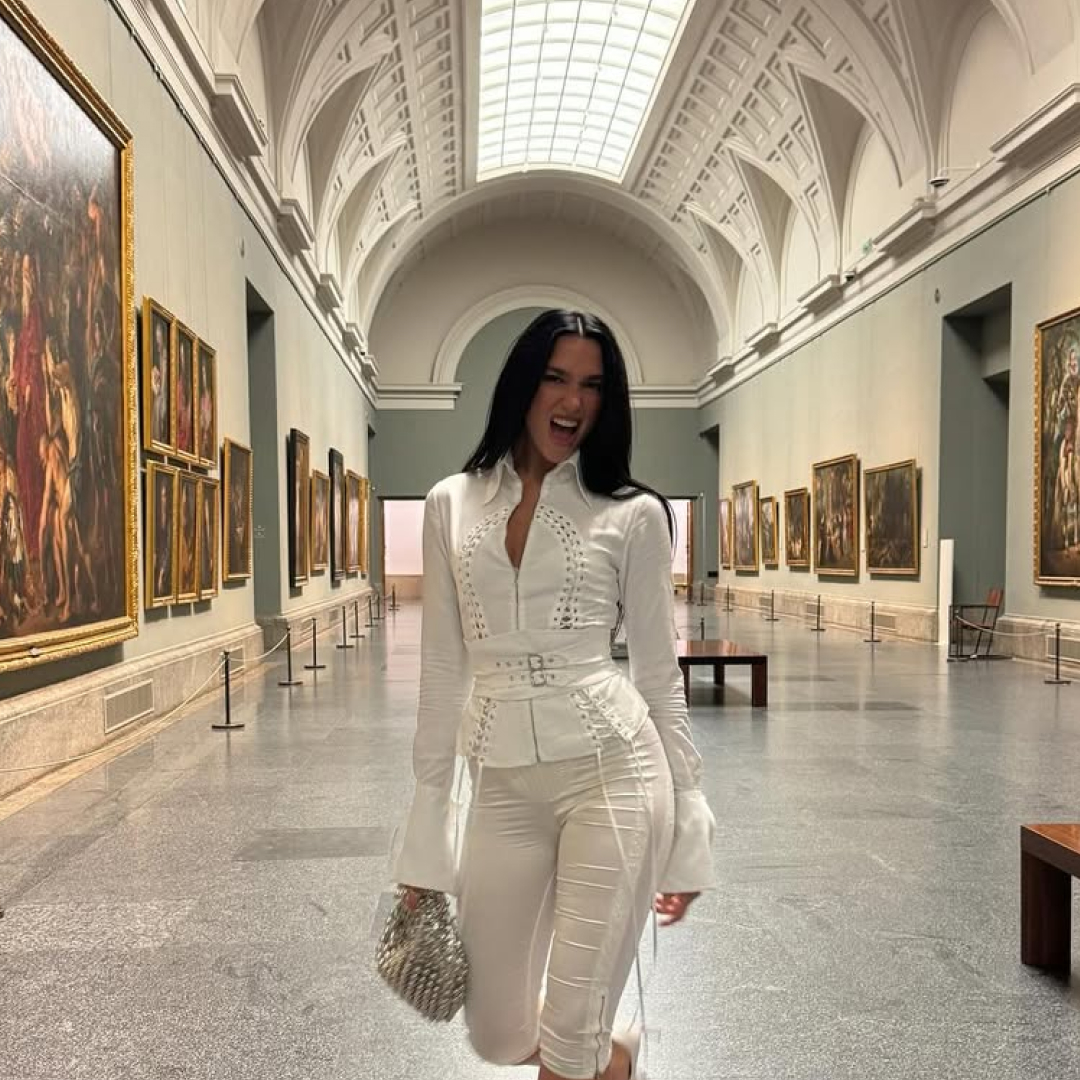 Dua Lipa at Madrid's Prado museum, posing in a Dilara outfit