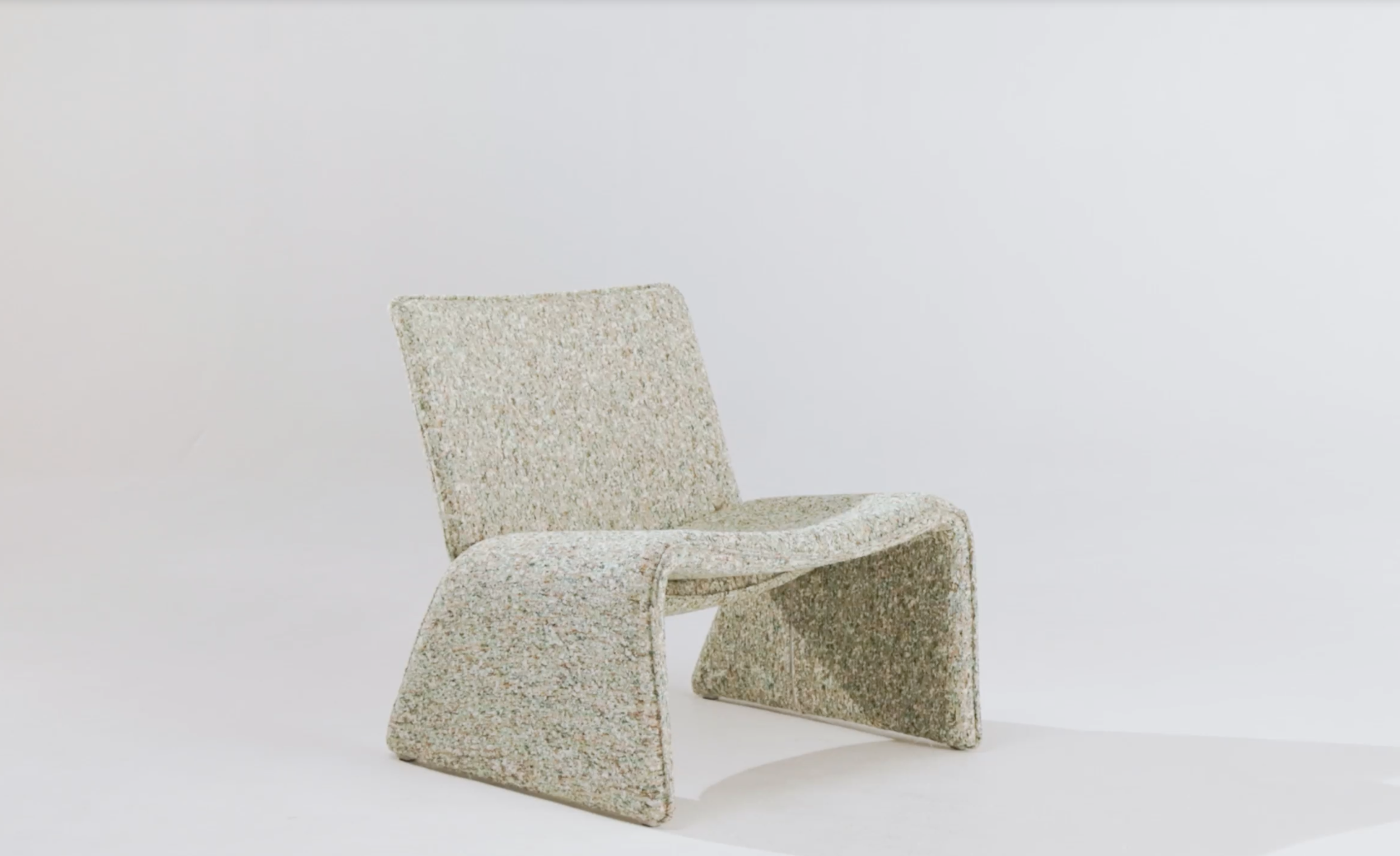 beige coloured lounge chair on white background