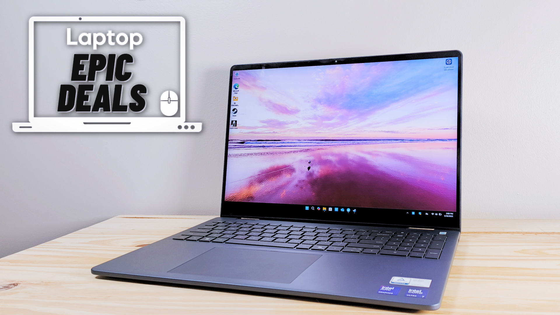 The Dell 16 Plus 2-in-1 on a wood table beside a Laptop Mag deals icon