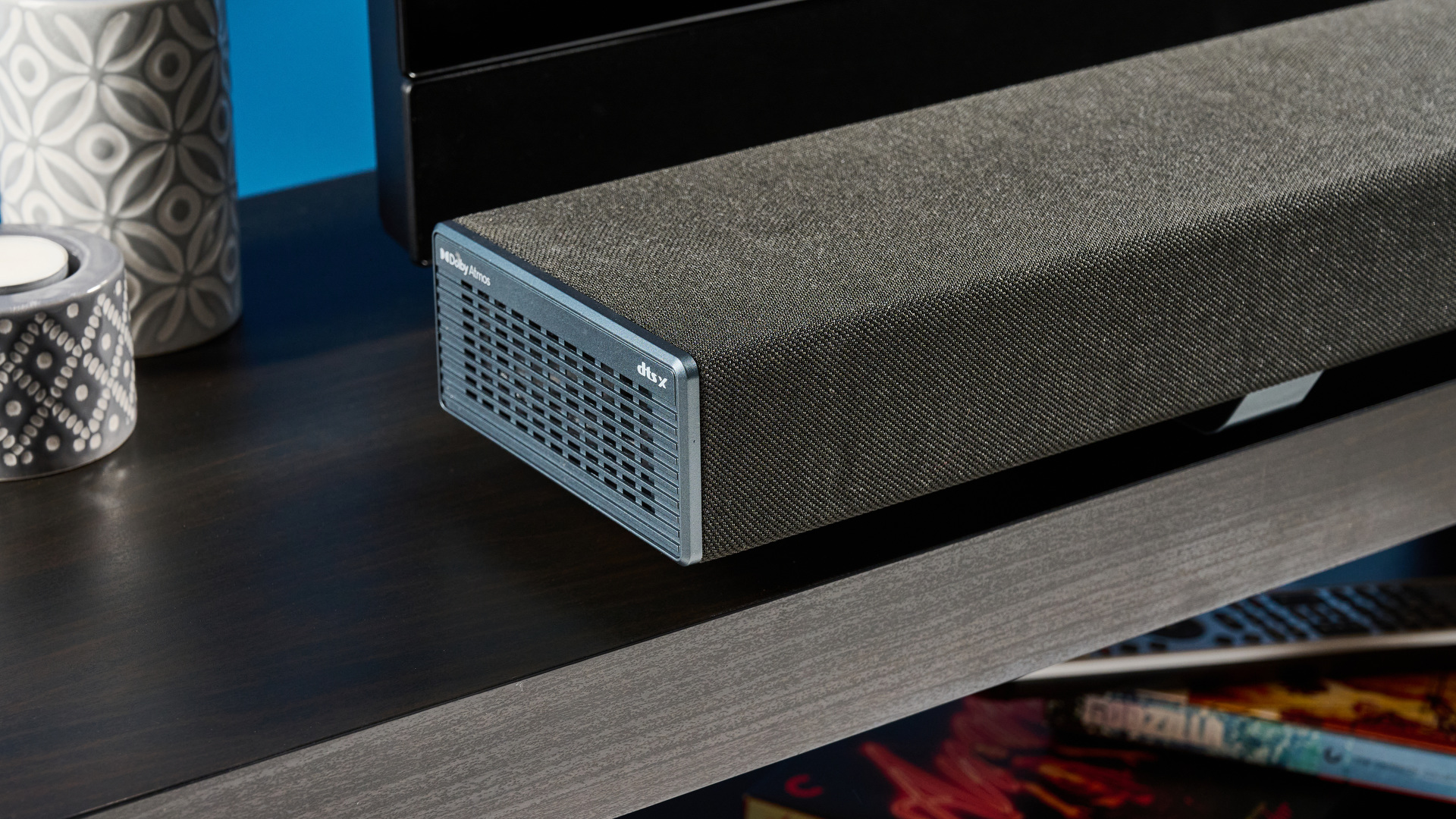The Sharp 5.1.2 HT-SBW55121 Soundbar photographed in front of a blue background.