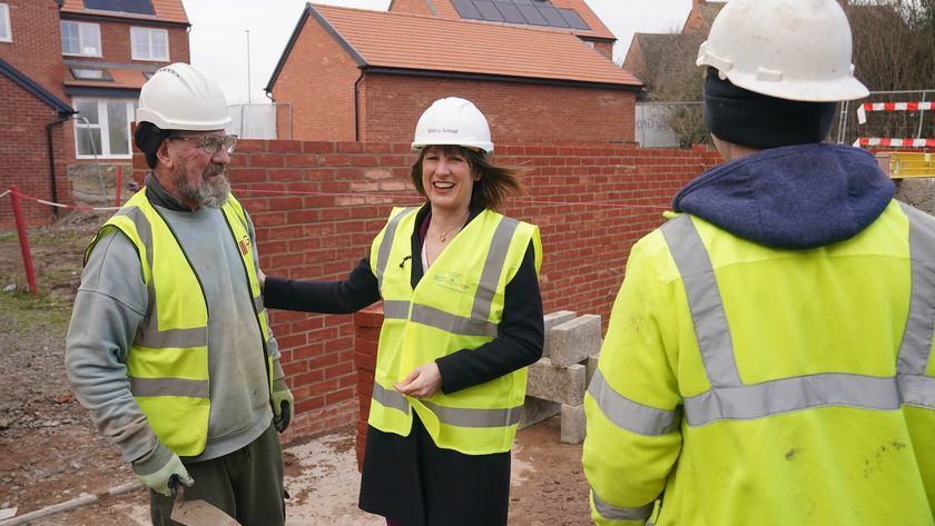 Rachel Reeves with builders on a building plot