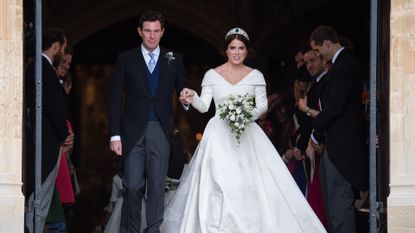 Princess Eugenie of York and Jack Brooksbank leave St George's Chapel in Windsor Castle following their wedding at St. George's Chapel on October 12, 2018 in Windsor, England