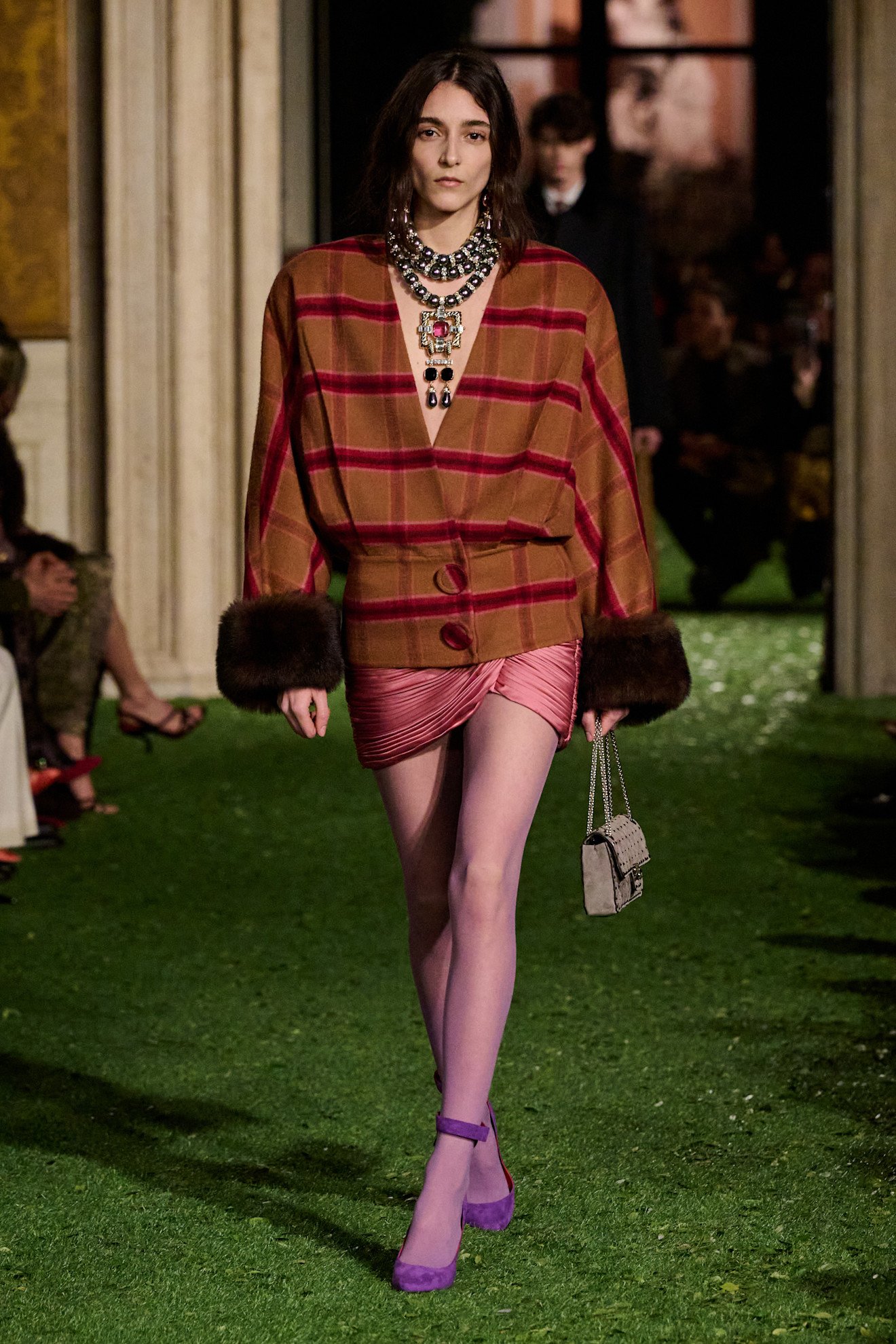 Photos of runway models at Valentino Fall Winter 2026 show.